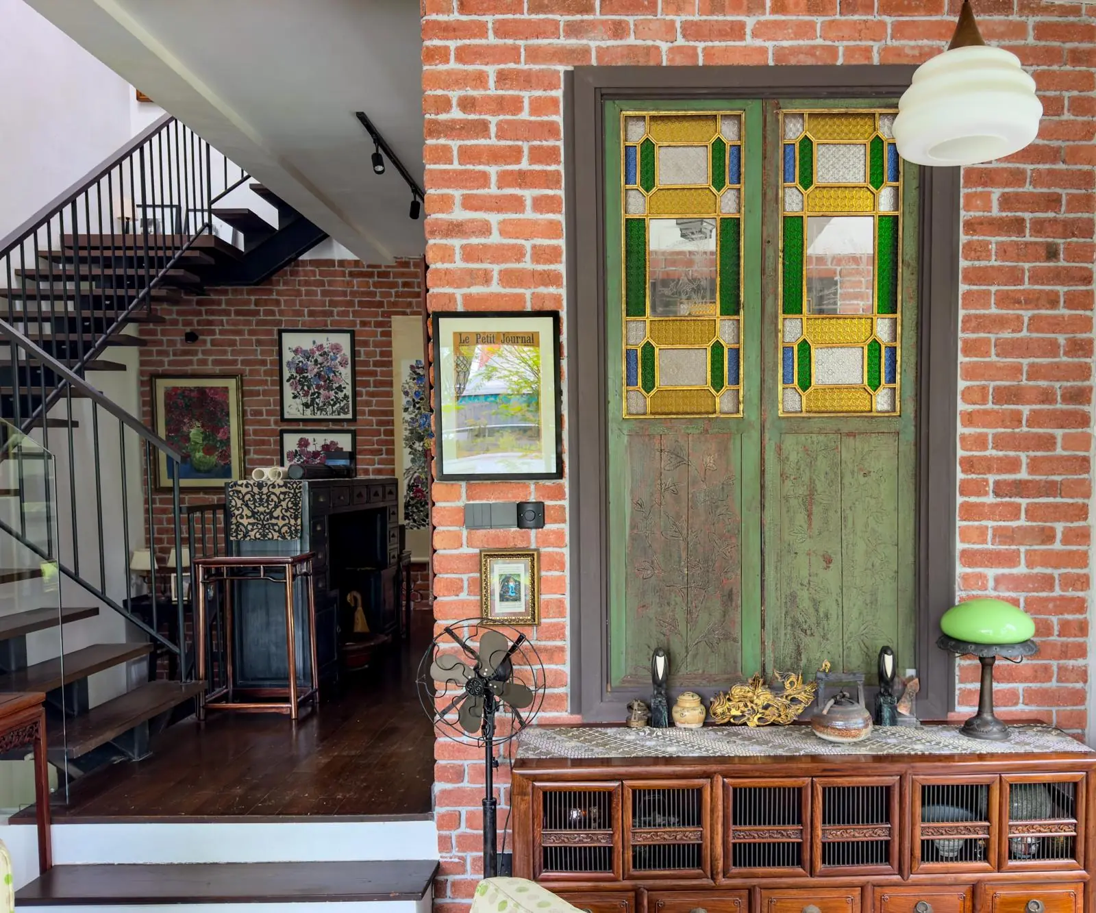Brick wall and stained-glass entrance