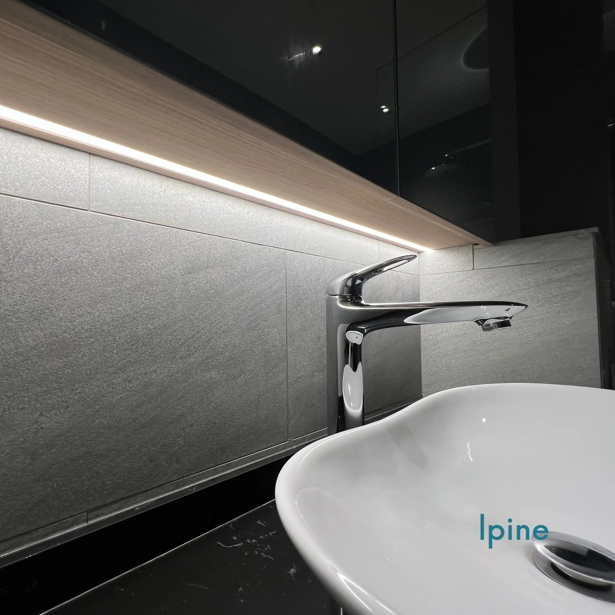 Basin and illuminated mirror detail